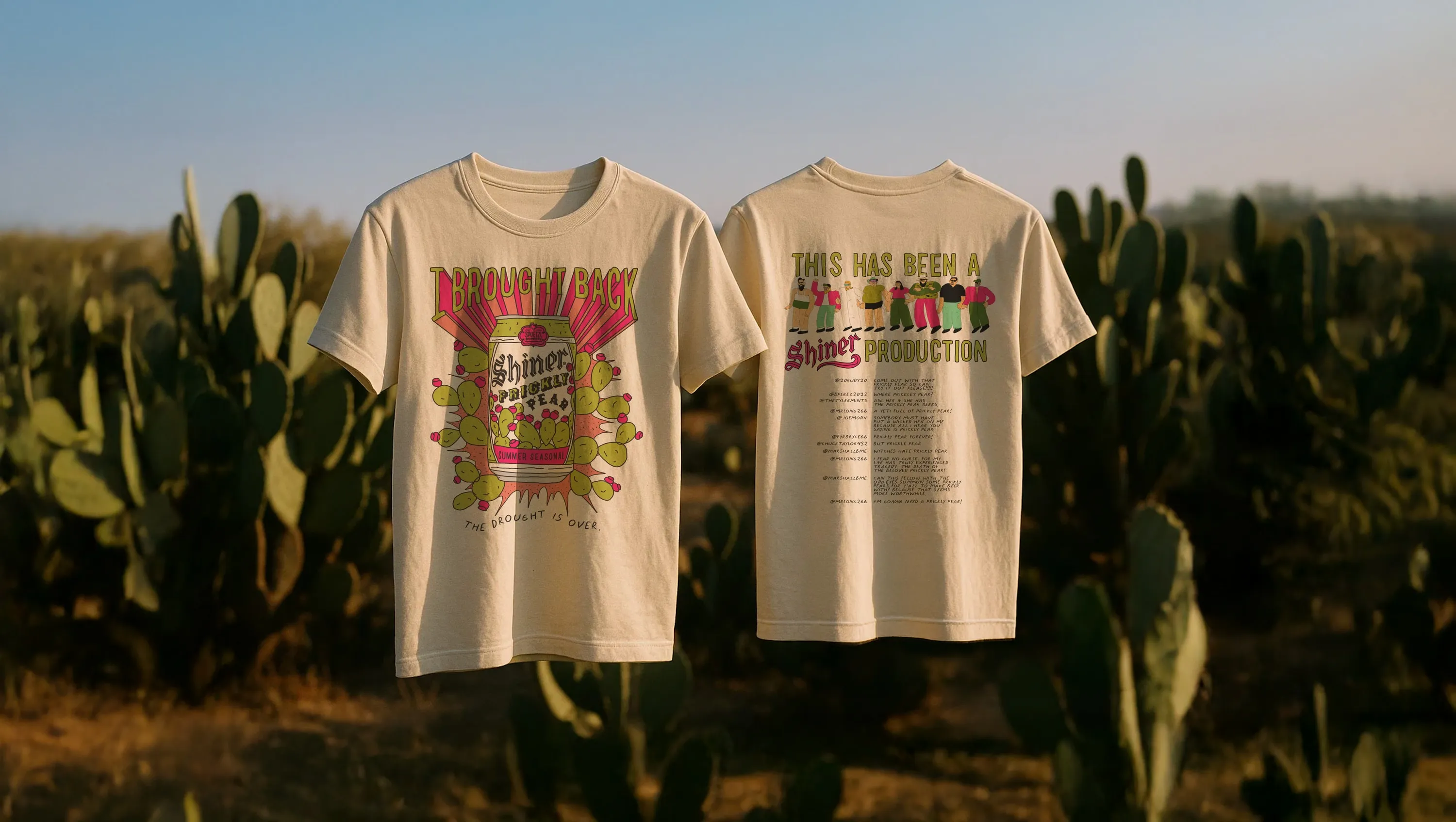 Two cream T-shirts hanging in front of prickly pear cacti. The front reads “I brought back Shiner Prickly Pear. The drought is over.” The back reads “This has been a Shiner production” over the seven drawn fans and their comments.